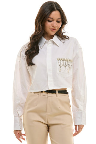 CAMISA ABOTONADA APLICACIONES BOLSA